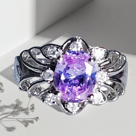 Jewelry - .🎄10/$20.  Silver Plated Fashion Ring with a Purple CZ Stone & 8 CZ Sto…